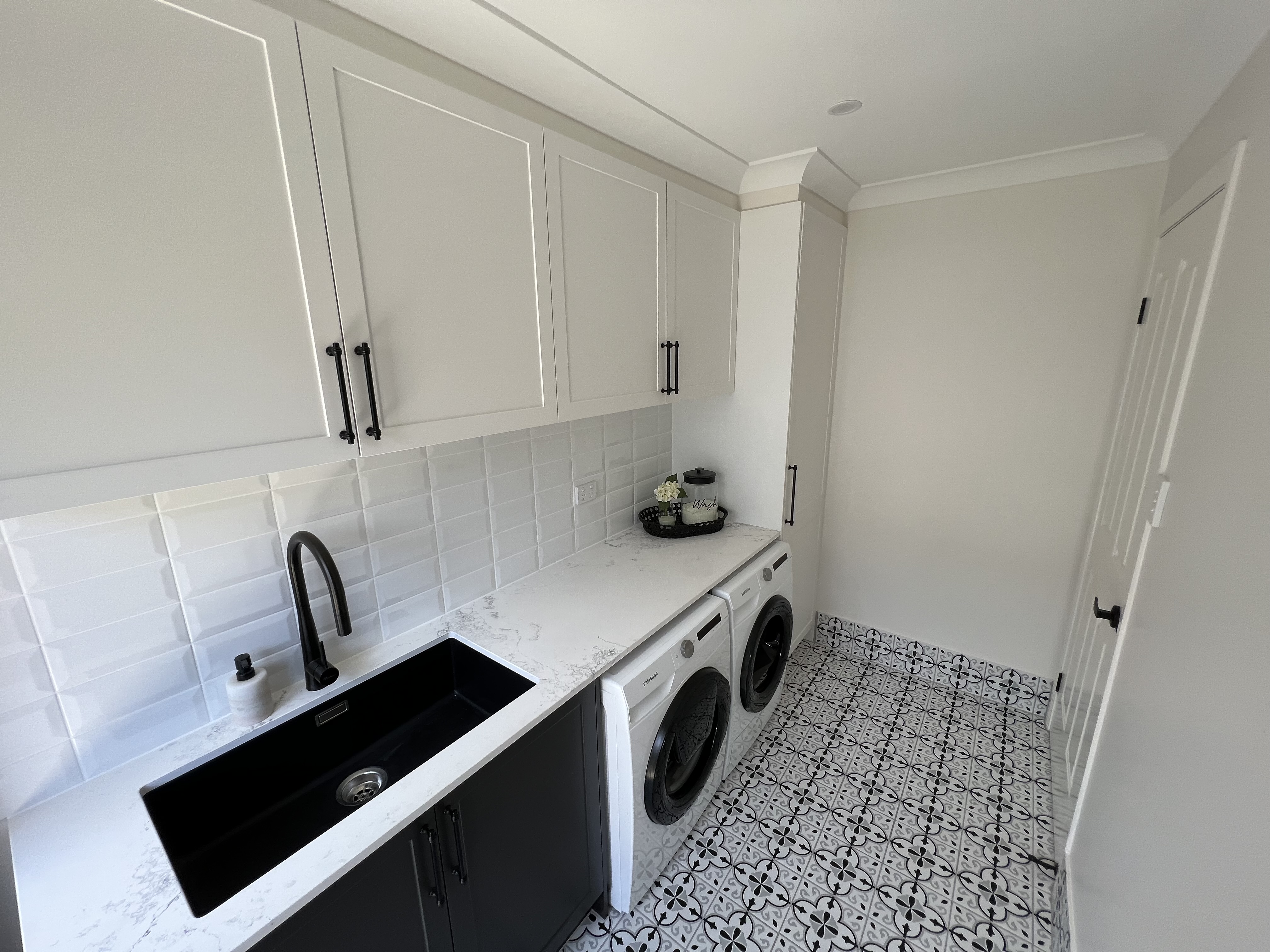 Stylish laundry with feature floor tiles!!